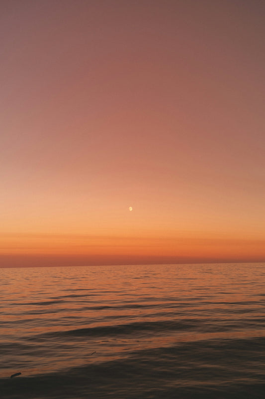 a sunset over a body of water